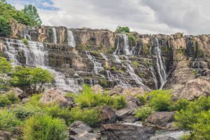Large panorama of Amazing Pongour Waterfall is famous and most beautiful of fall in Vietnam. Not far from Dalat city estimate 45 Km. Dalat, Vietnam.